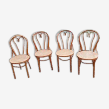 4 tanned bistro chairs