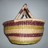 Round and colorful straw basket with handles