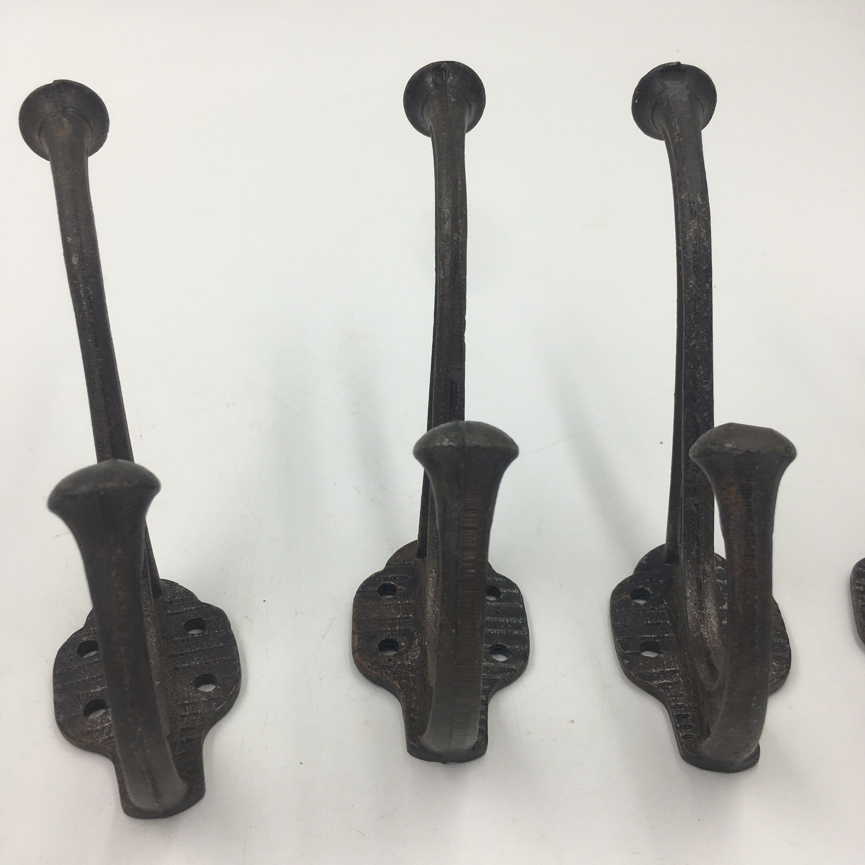 Set of 5 cast iron hooks early 20th