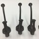 Set of 5 cast iron hooks early 20th