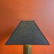 Brass shell socket lamp from the 1st WW, black pyramidal lampshade in Carlucci linen.
