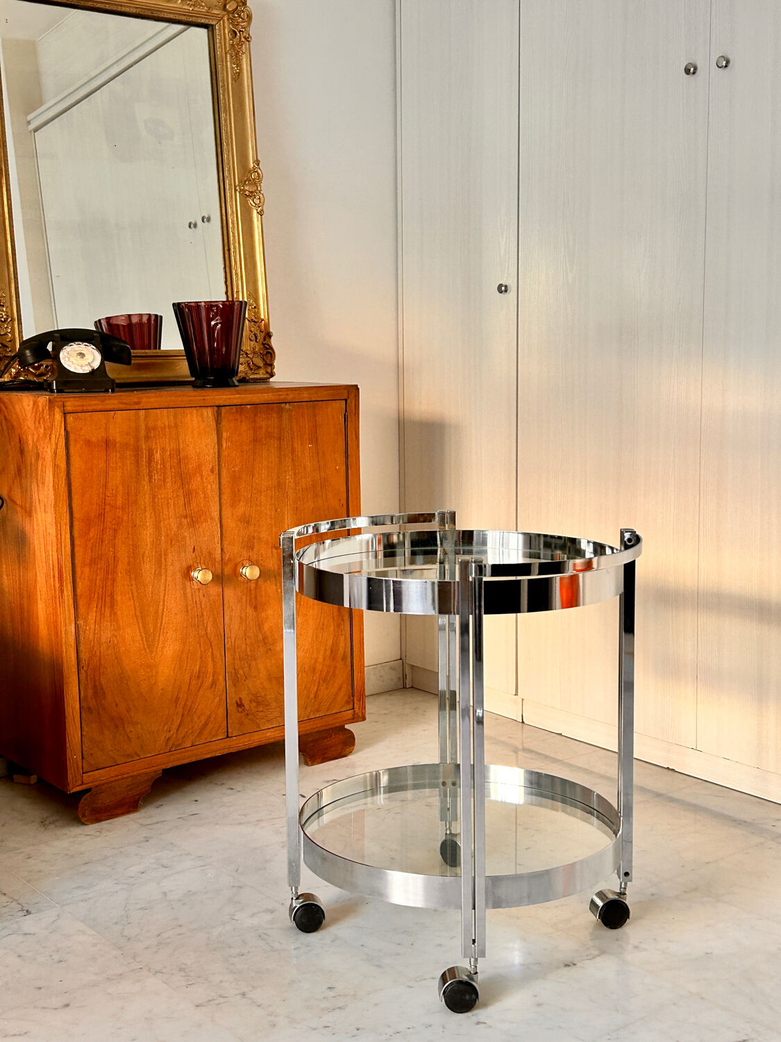 Vintage round dessert trolley in chrome steel, with two glass shelves.
