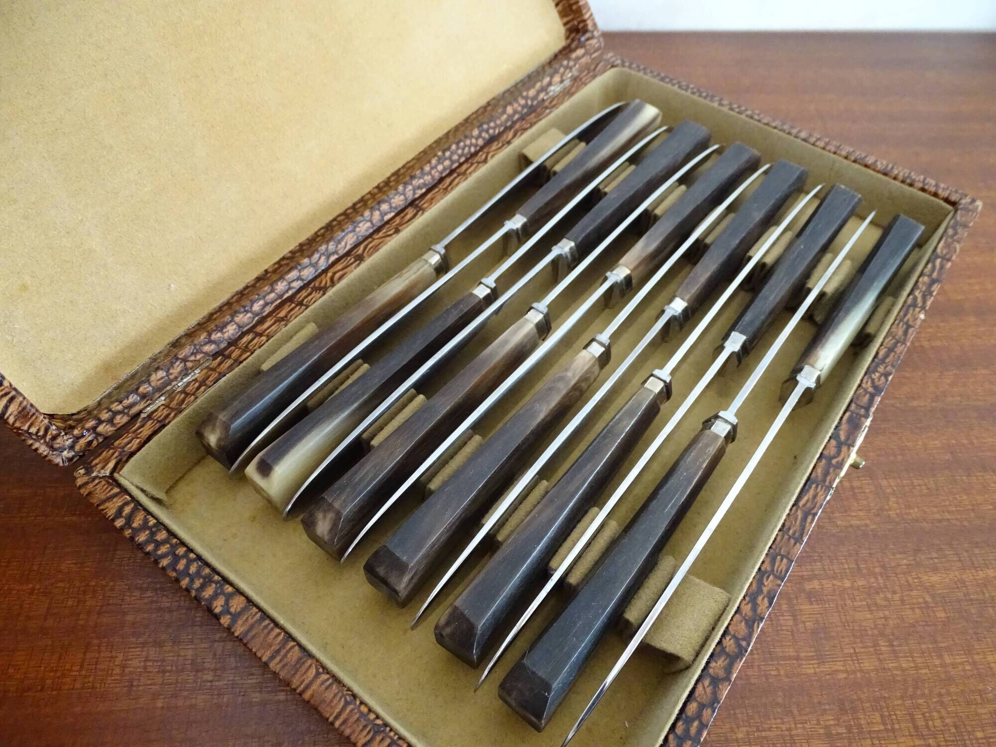 12 vintage Pradel cheese knives horn and stainless steel handles in case