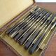 12 vintage Pradel cheese knives horn and stainless steel handles in case