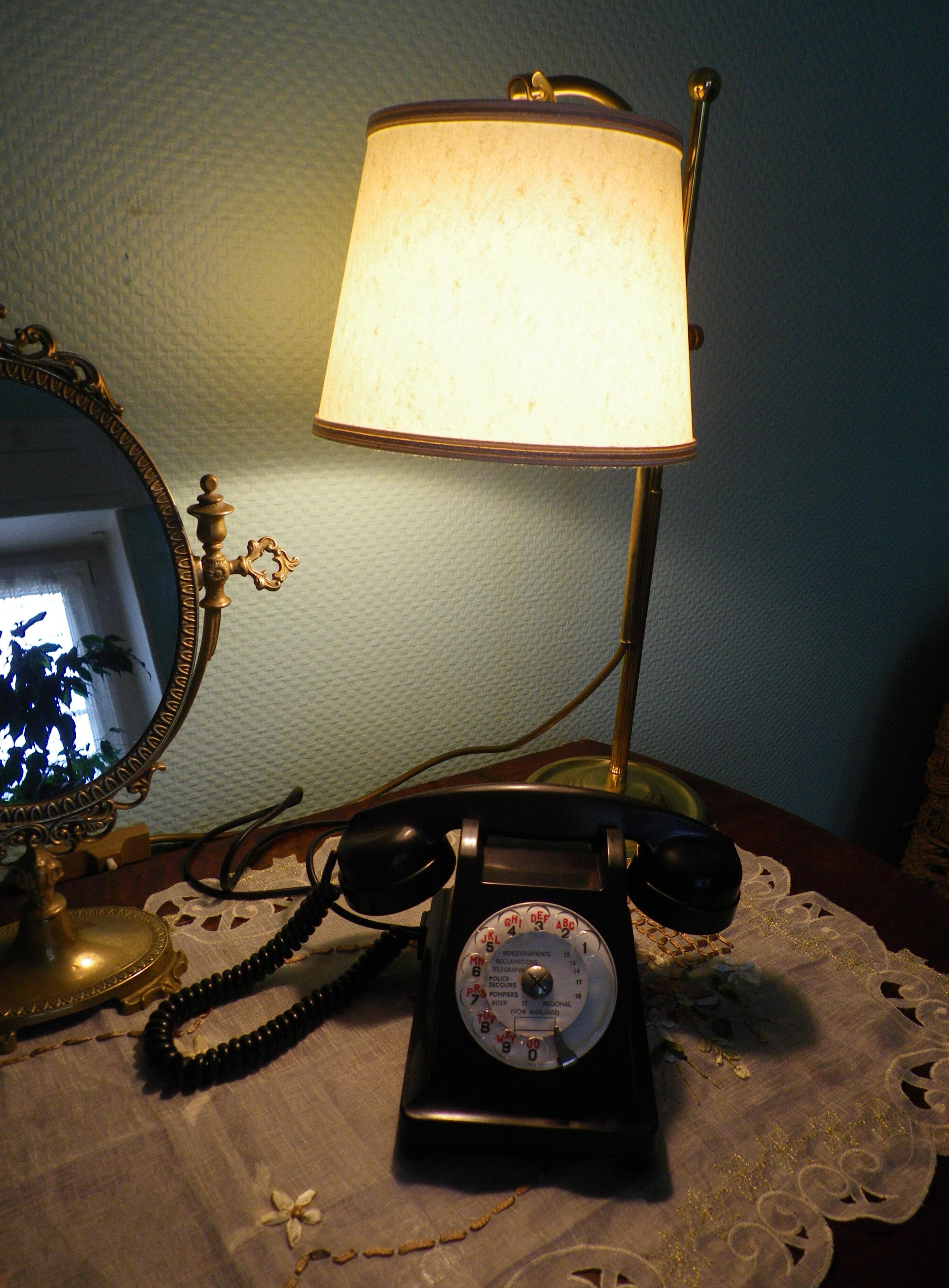 Black bakelite phone with earphone