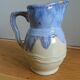 Pastel blue pitcher signed