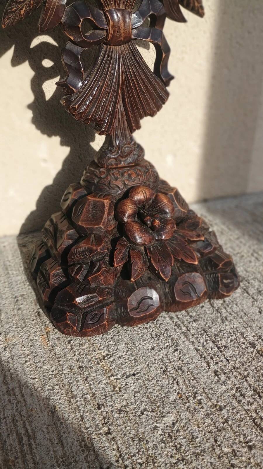 Antique wooden crucifix carved from the Black Forest with grapes and leaves.