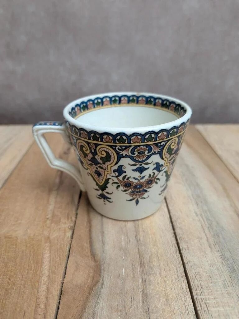 Antique ironstone cup from Sarreguemines with polychrome decoration.