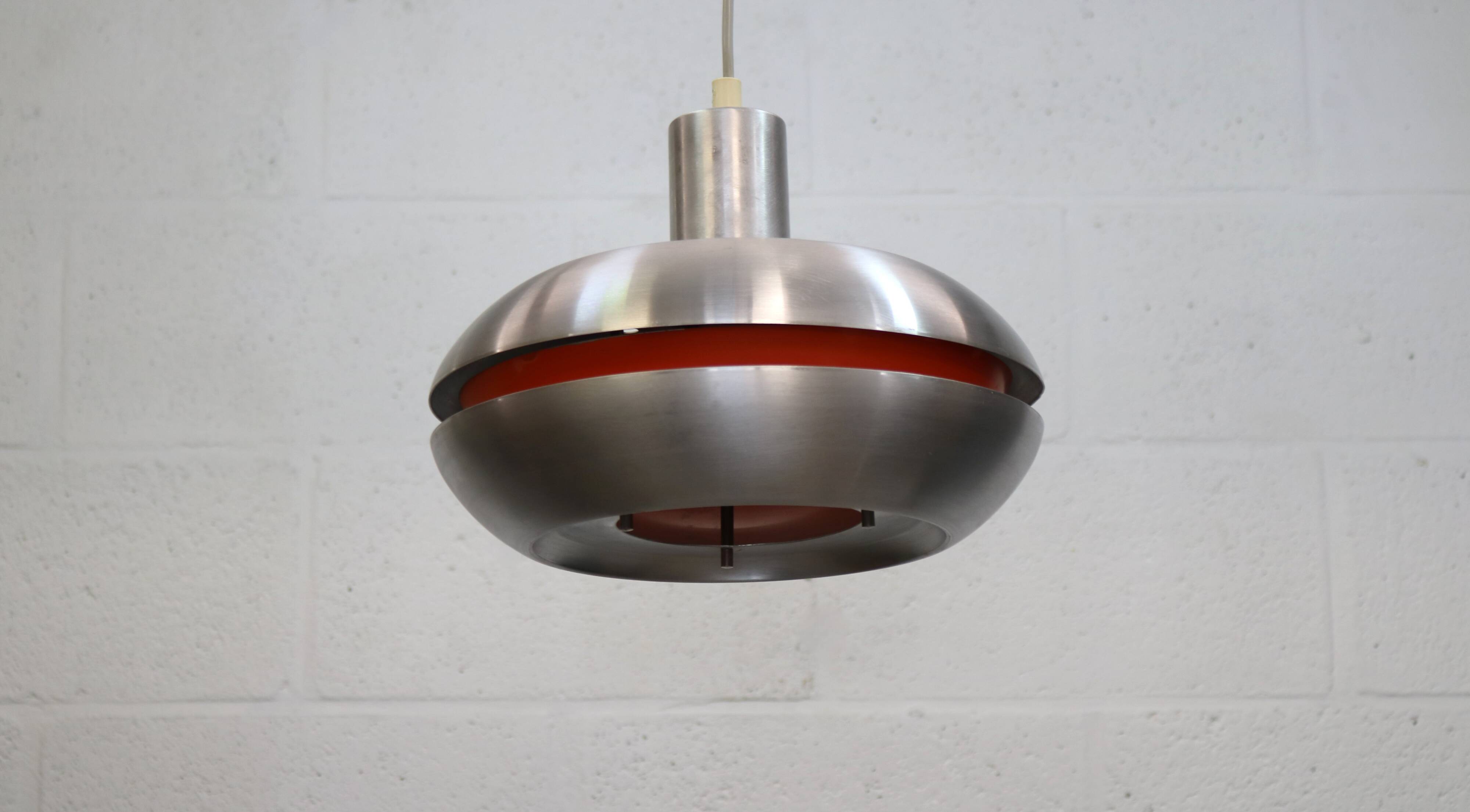 Old Danish space age design lamp in alu and orange inside.