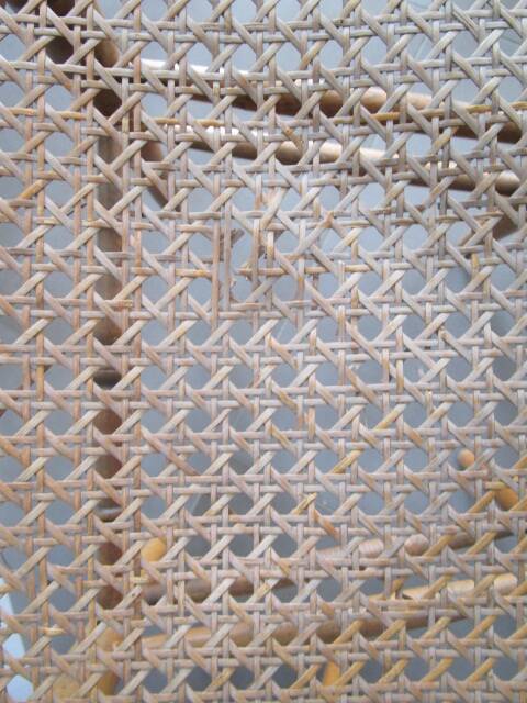 Pair of old caned chairs in blond wood