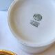 2 white and gold Limoges porcelain tea cups
