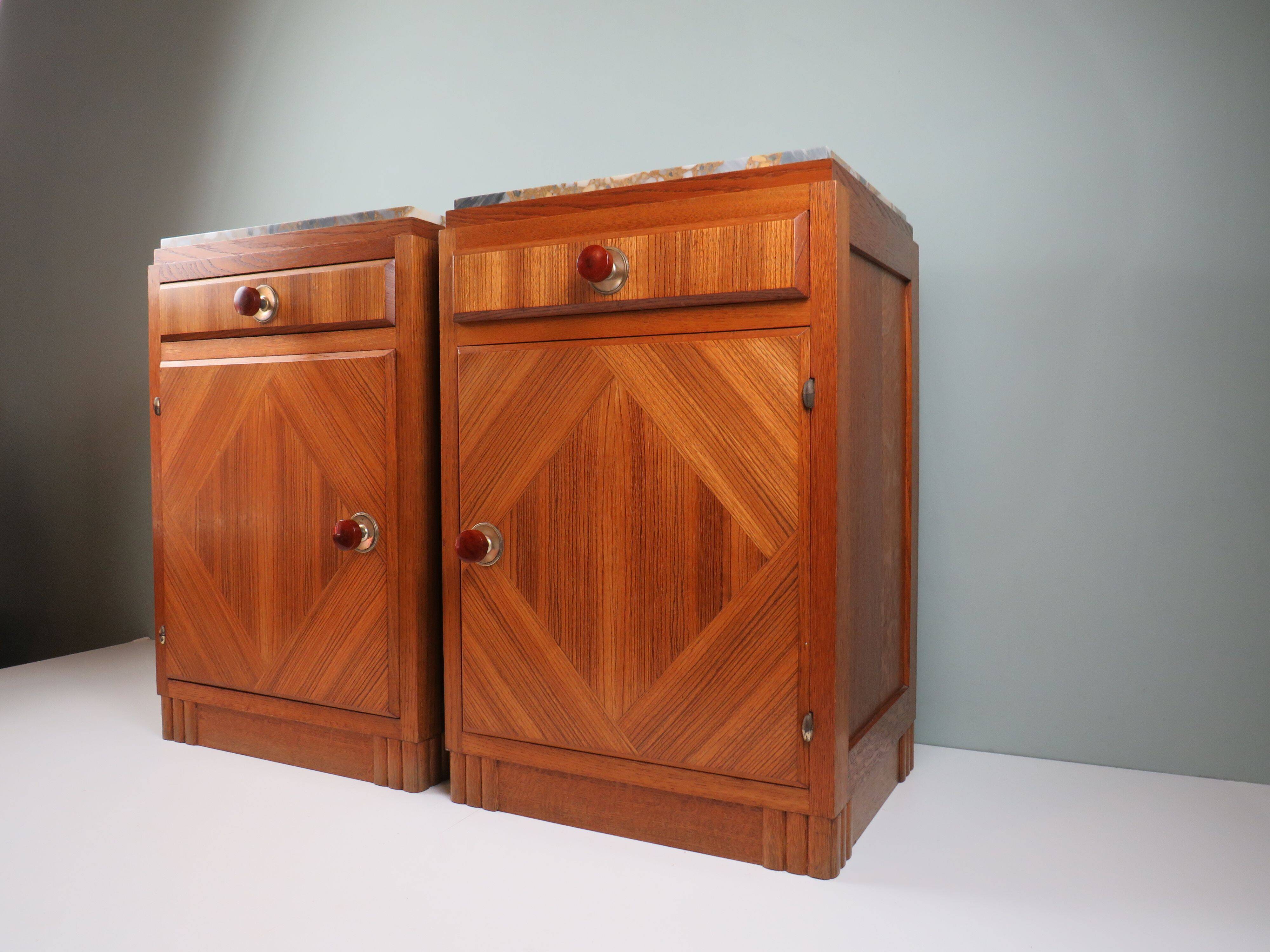 Art Deco bedside tables in oak with an inlaid marble top.