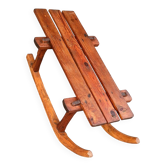 Rustic bench, old folk art, snow sled, Alps.