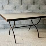 Table made of wrought iron and cement