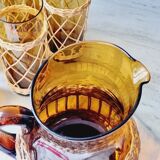 Carafe and glasses in blown amber glass and wicker