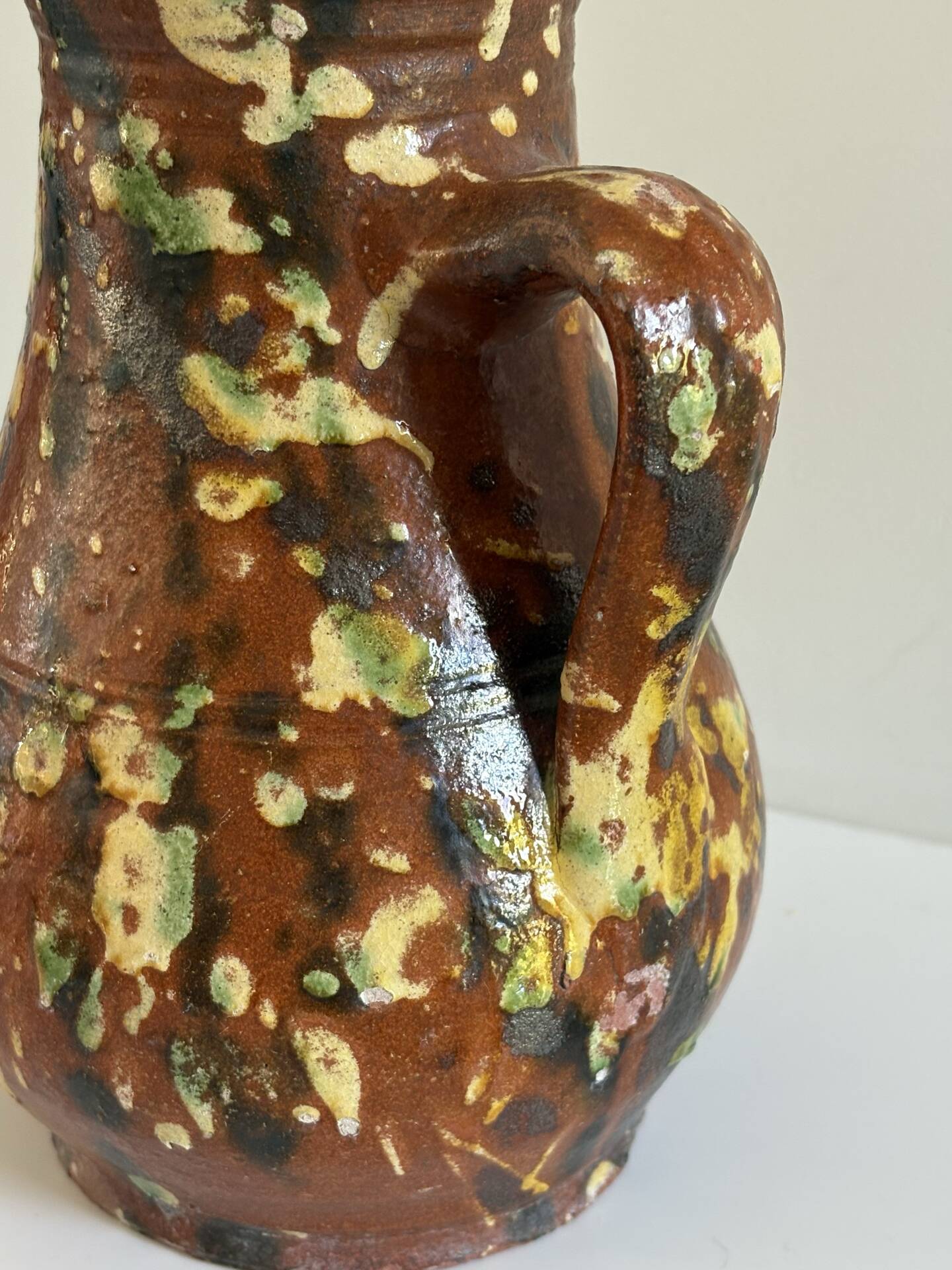 Studio ceramic pitcher with sprayed glazes – circa 1960-70