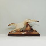 Beige and brown ceramic representing a “Greyhound/vintage 1930