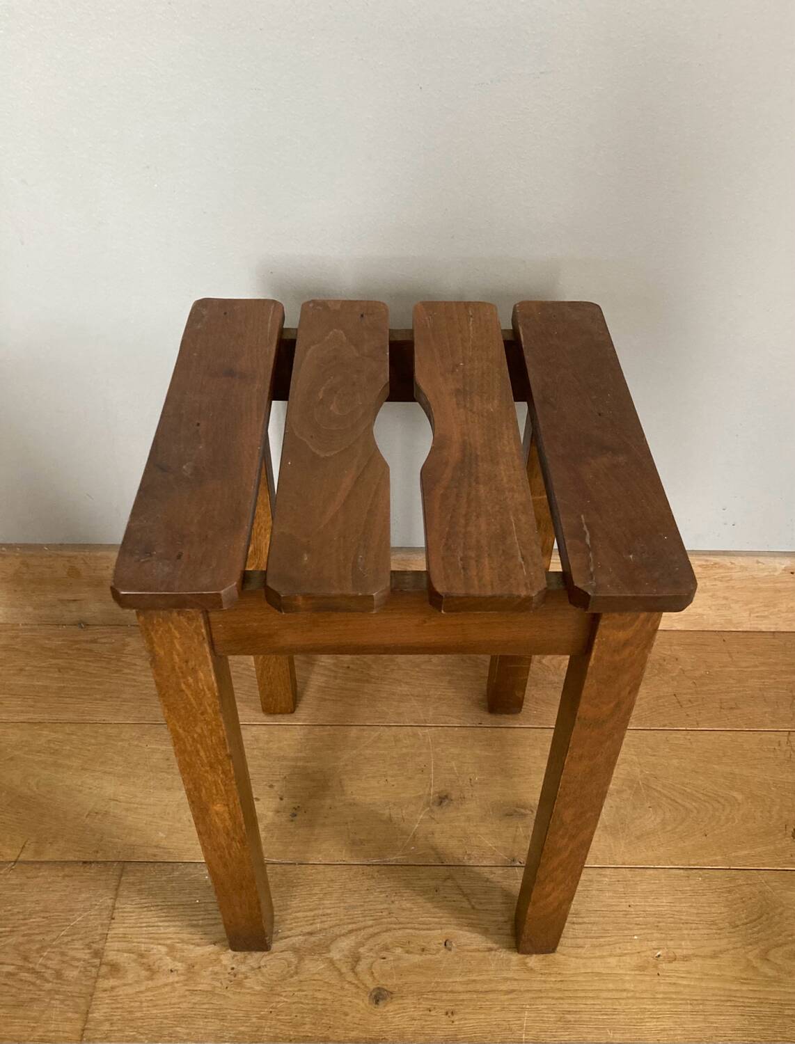 Wooden stool with central grip, quadripod base, 20th century