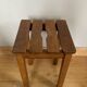 Wooden stool with central grip, quadripod base, 20th century