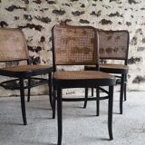 Blackened wooden chairs and cannage around 1980