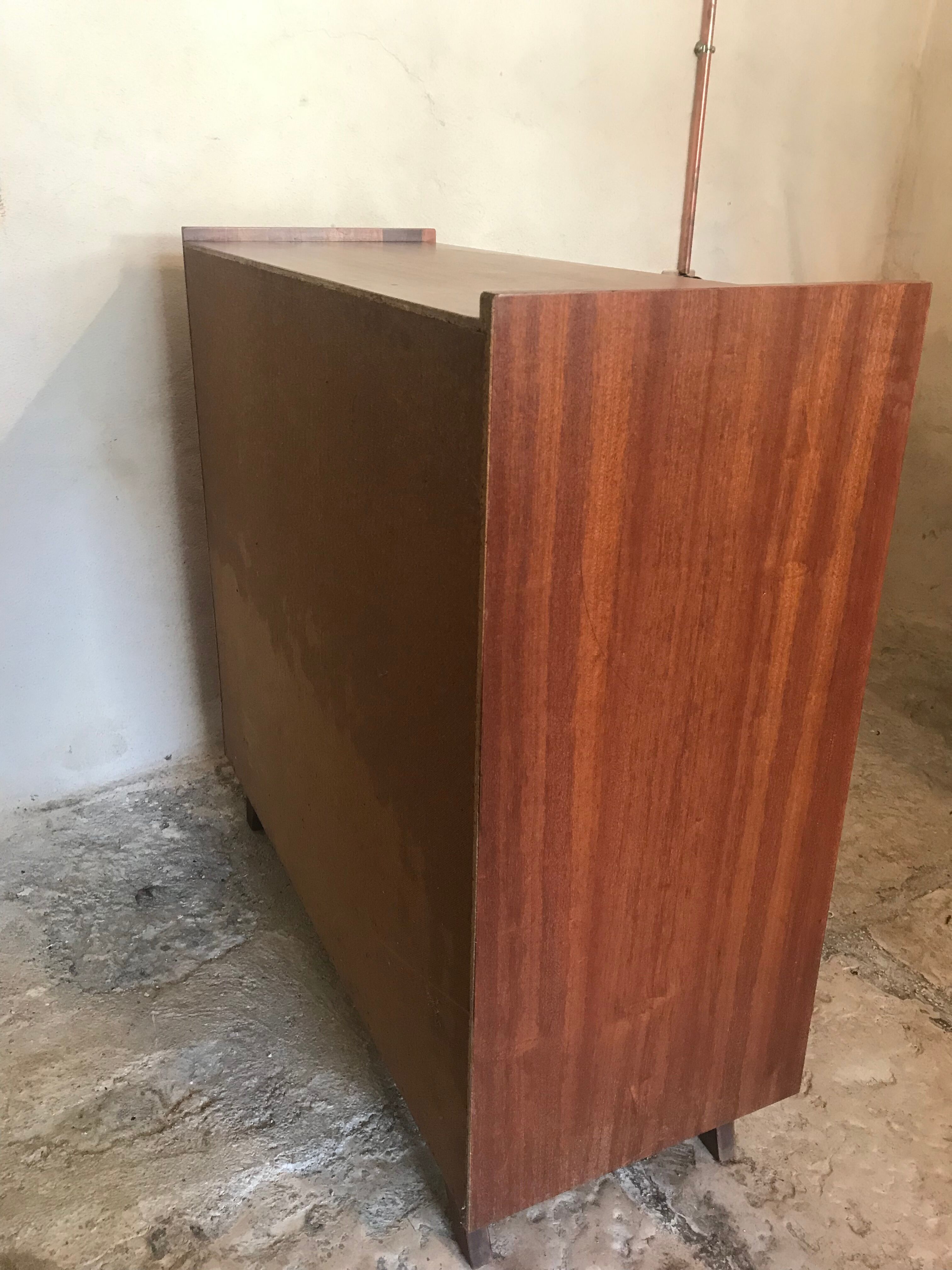 Vintage storage cabinet teak veneer sliding door compass feet