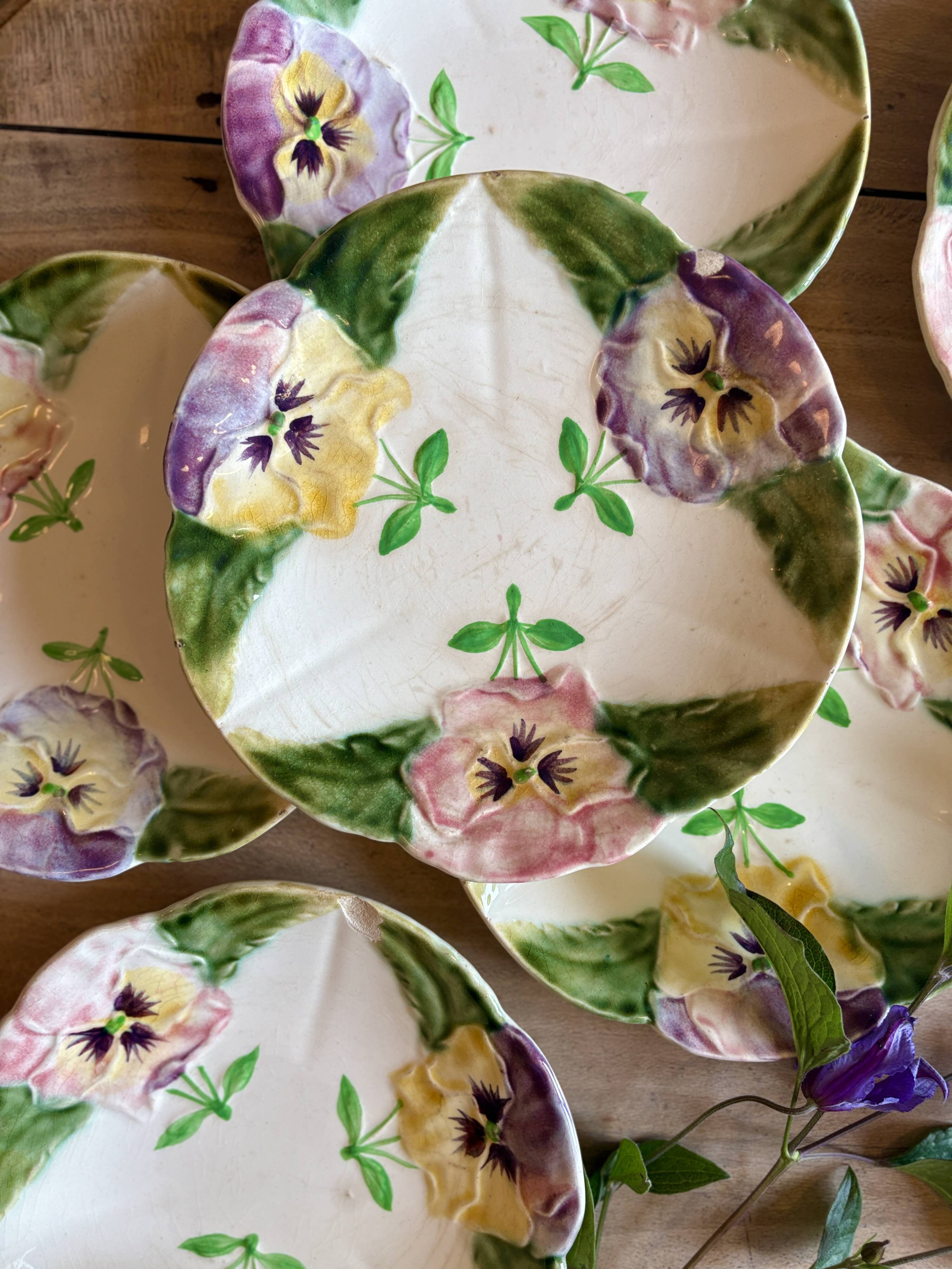Set of 10 antique slip plates with flower decorations