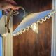 Pair of wall sconces in brass and wavy opaline glass