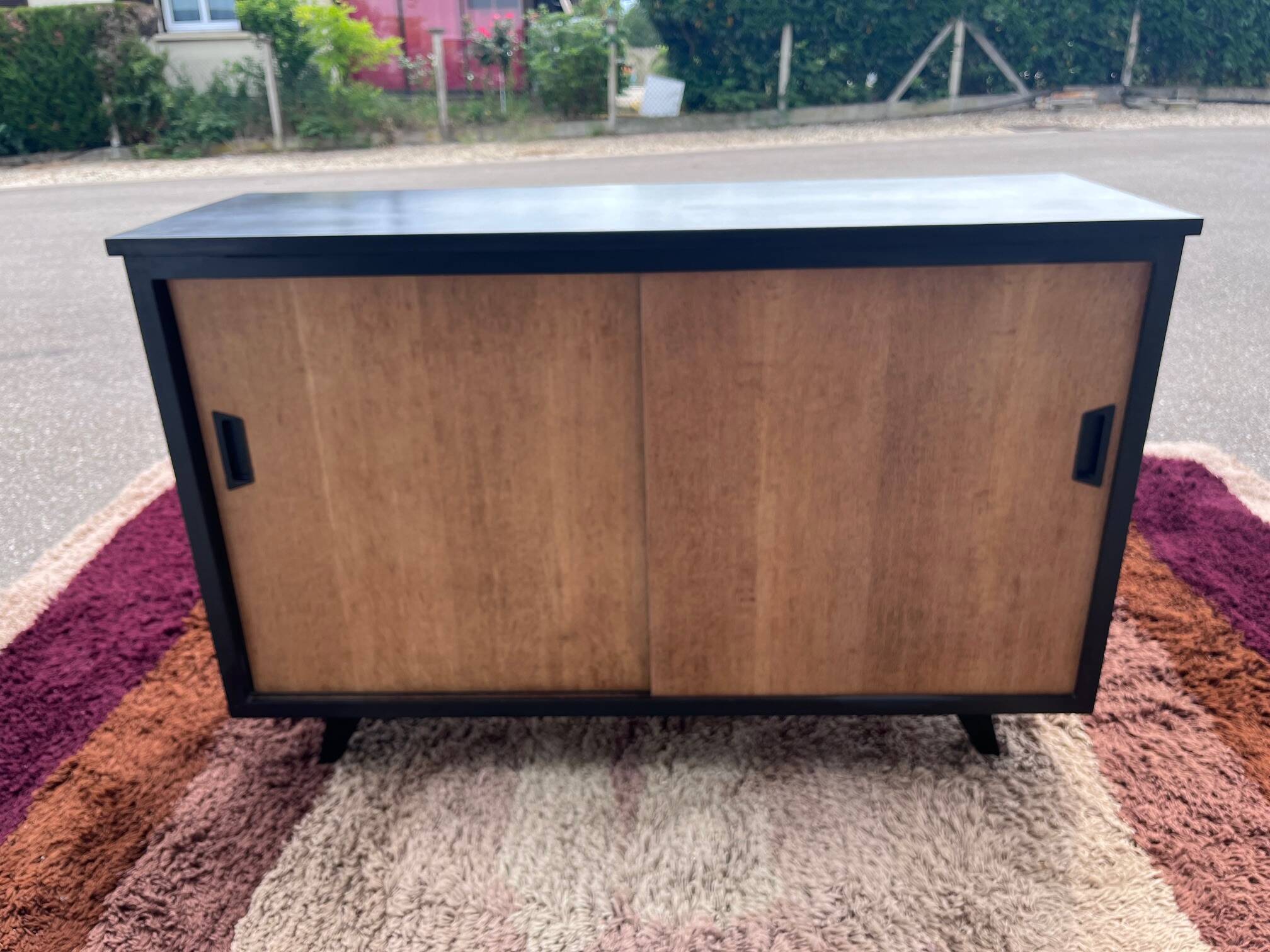black and wood two-door sideboard