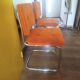 Pair of vintage cantilever chairs in chrome and orange corduroy.