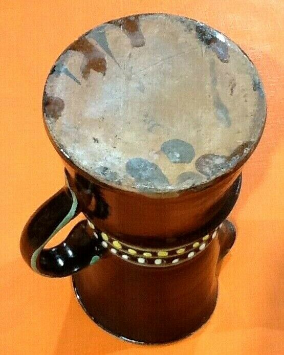 Glazed terracotta pitcher decorated with beaded friezes