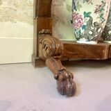 Console inlaid with black marble and lion's paw legs.