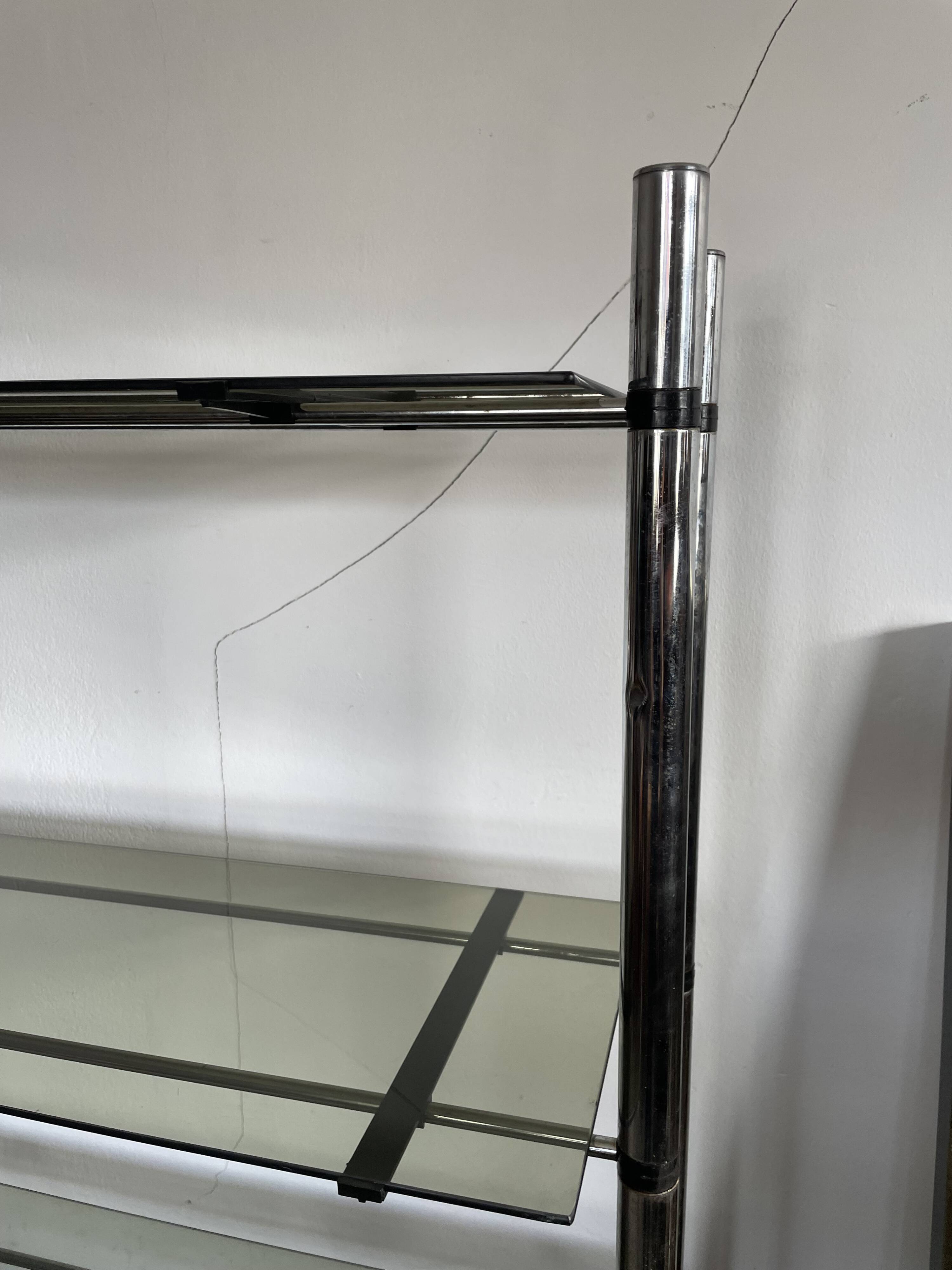 Chromed metal tubular shelf with smoked glass.