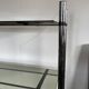 Chromed metal tubular shelf with smoked glass.