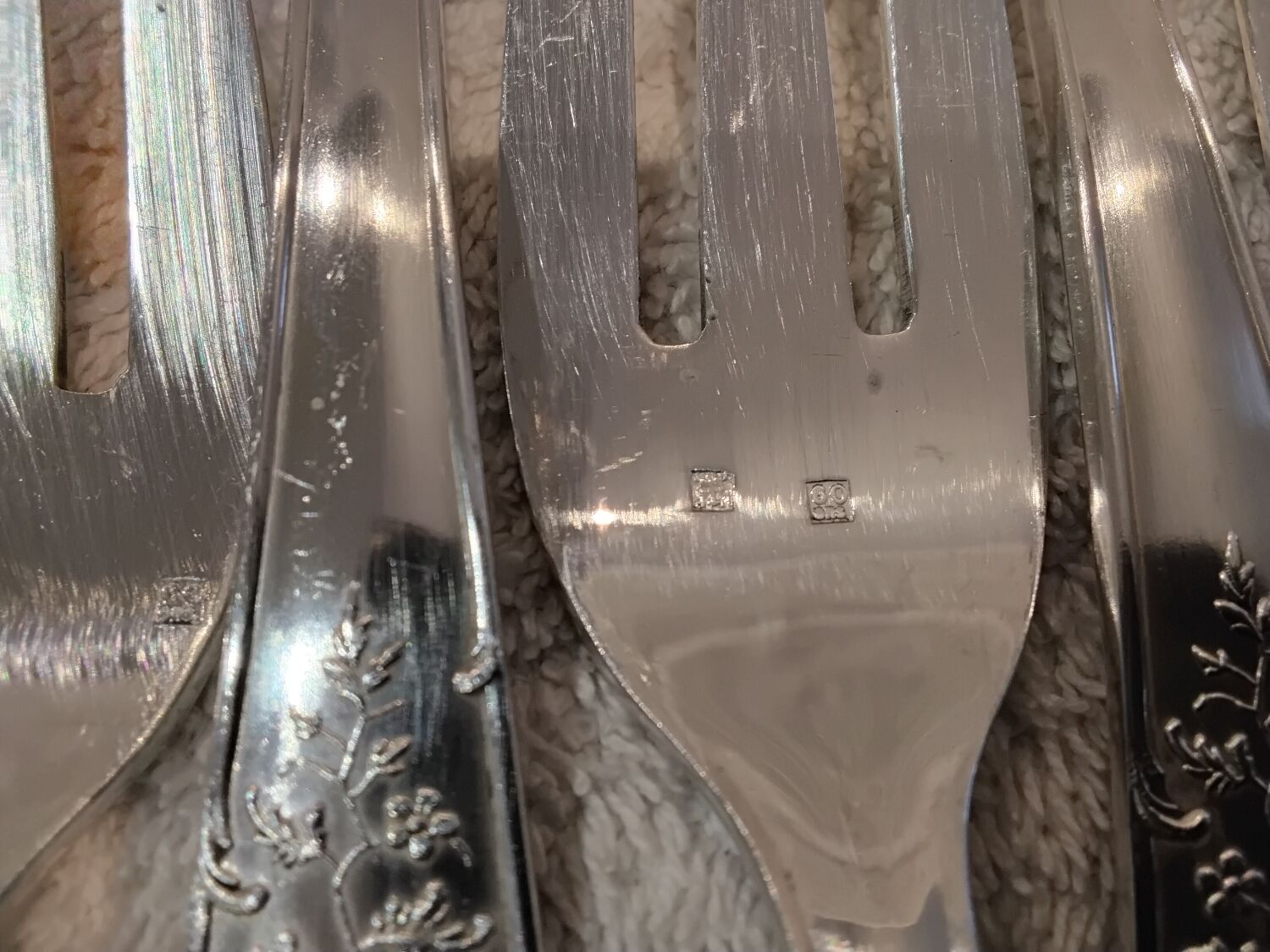 12 forks, 12 fish knives, silver-plated metal, rocaille pattern