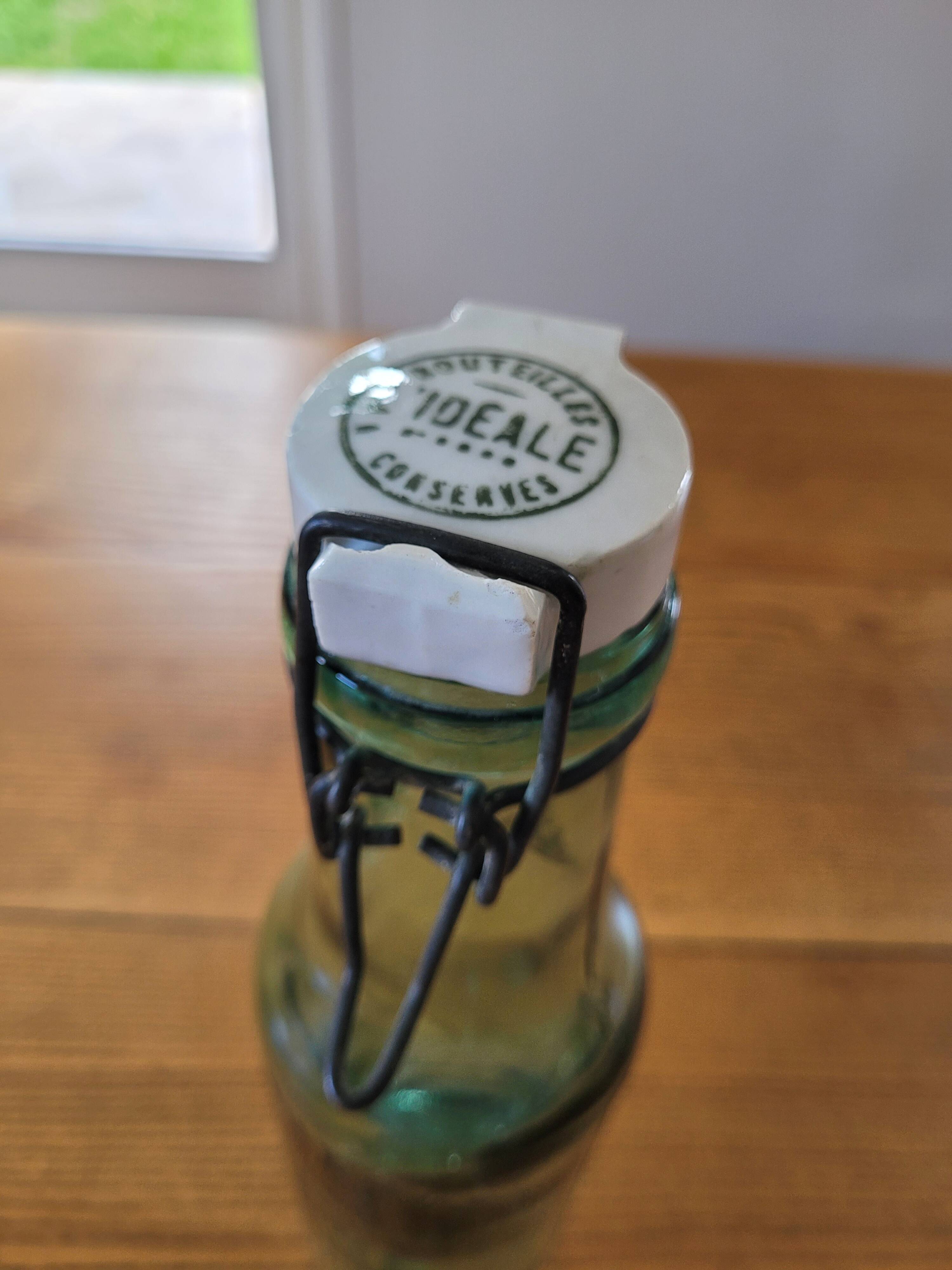 Vintage glass bottle l'Idéale with porcelain stopper
