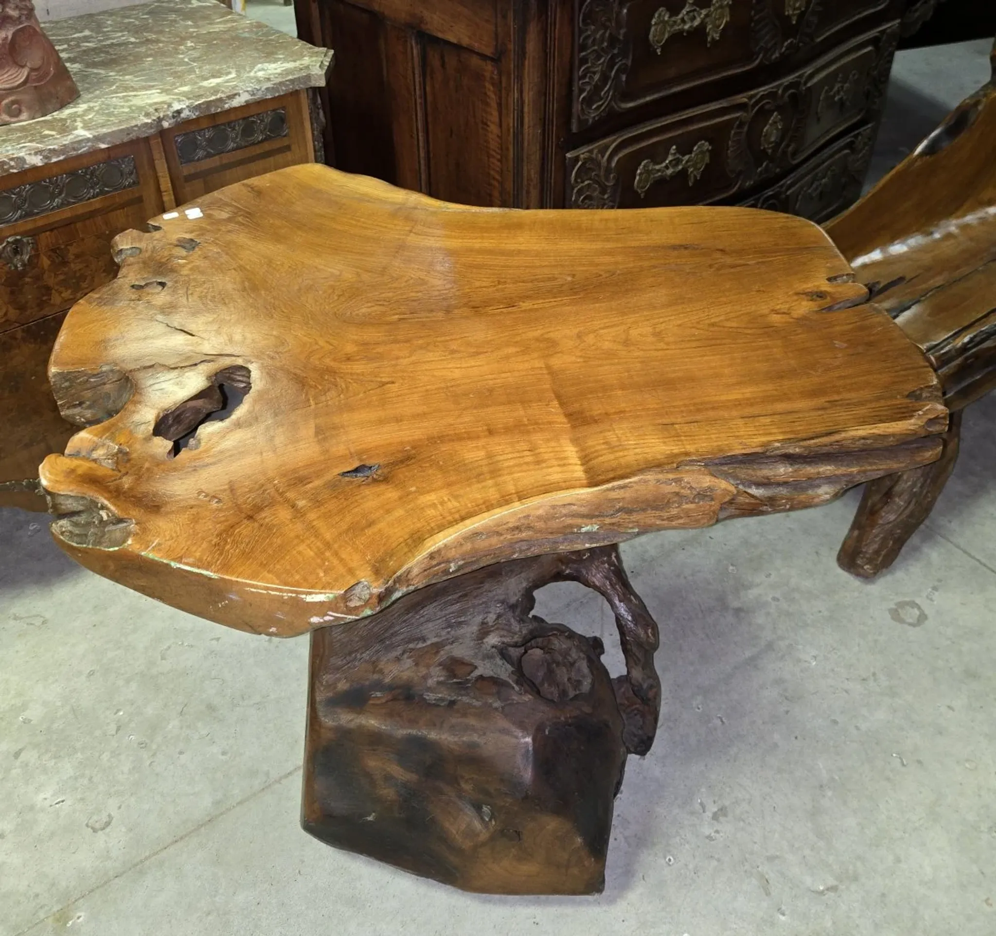 Sculpted olive wood table, made from a root.