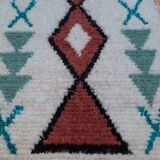 White Boucherouite Moroccan Berber rug with colorful patterns