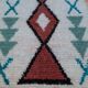 White Moroccan Boucherouite Berber rug with colorful patterns