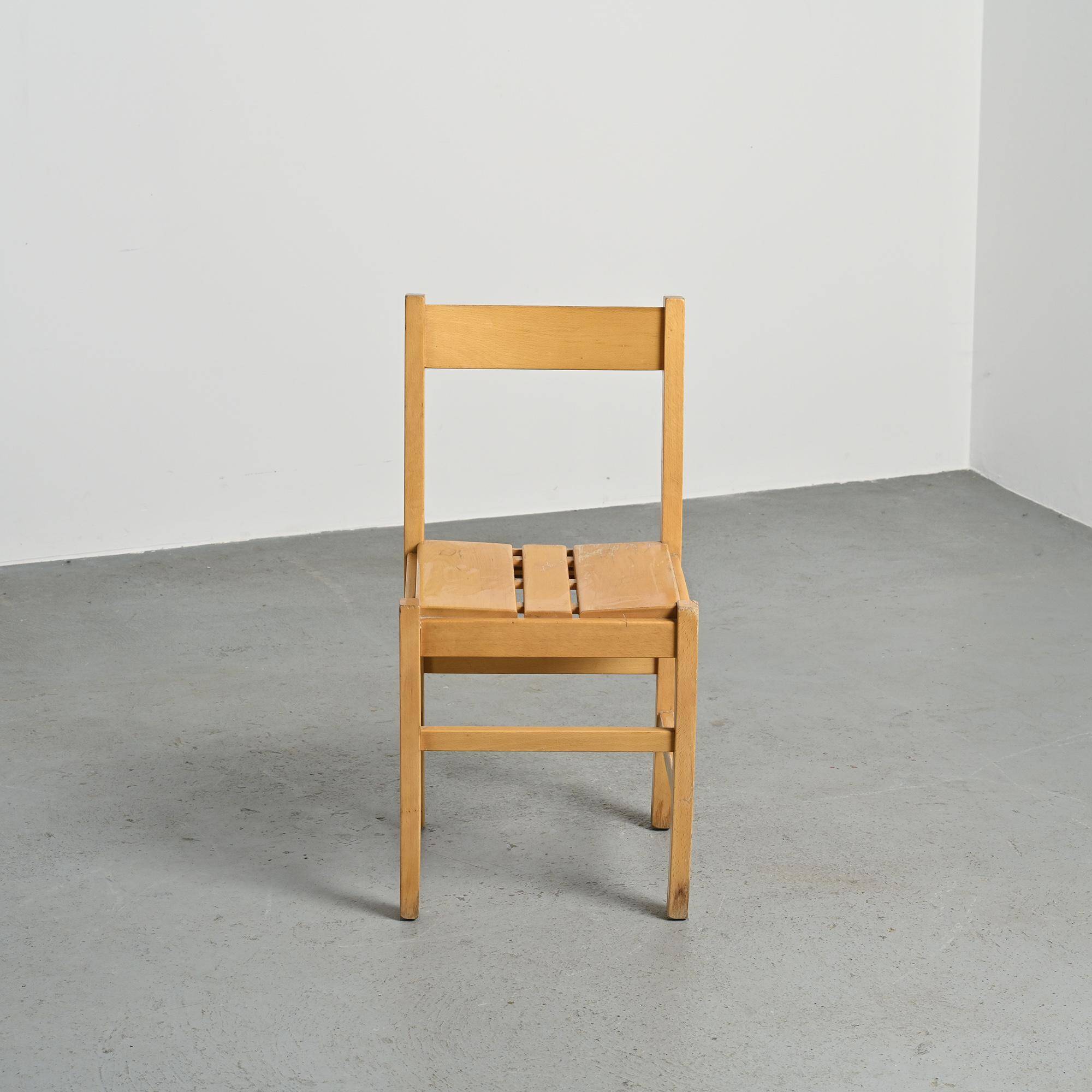 Set of six solid pine chairs by Maison Regain.