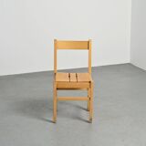 Set of six solid pine chairs by Maison Regain.