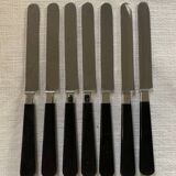 Batch of black cheese knives
