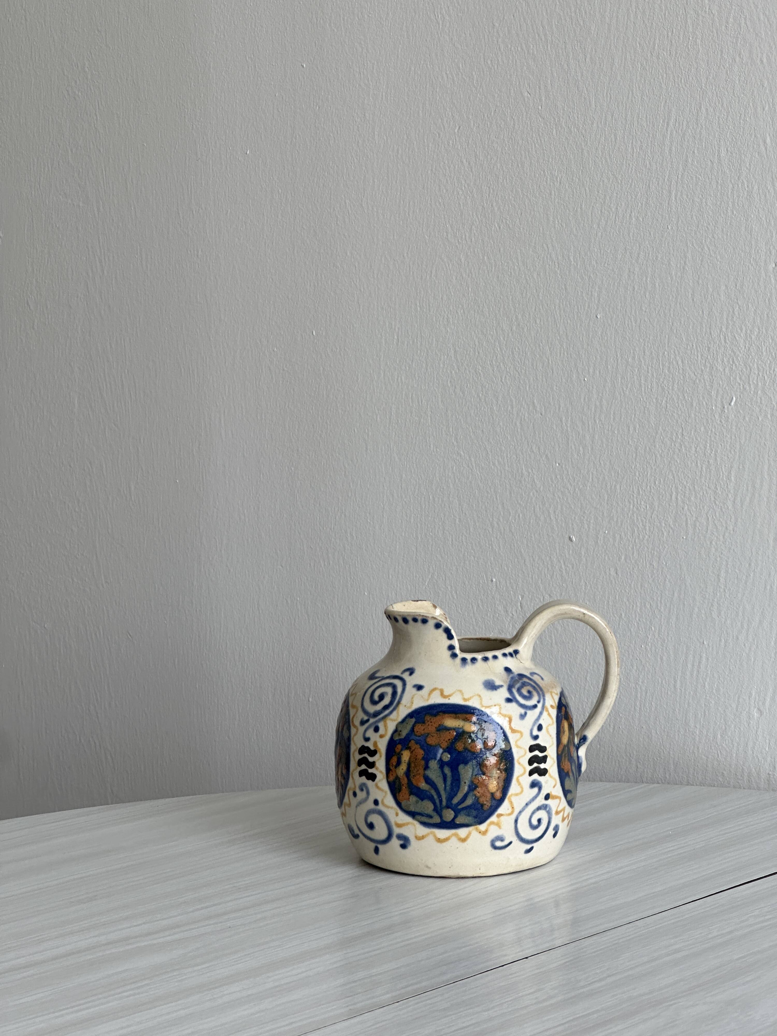 Hand painted ceramic decorative pitcher