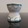 Old porcelain diabolo egg cup decorated with green frieze and garlands