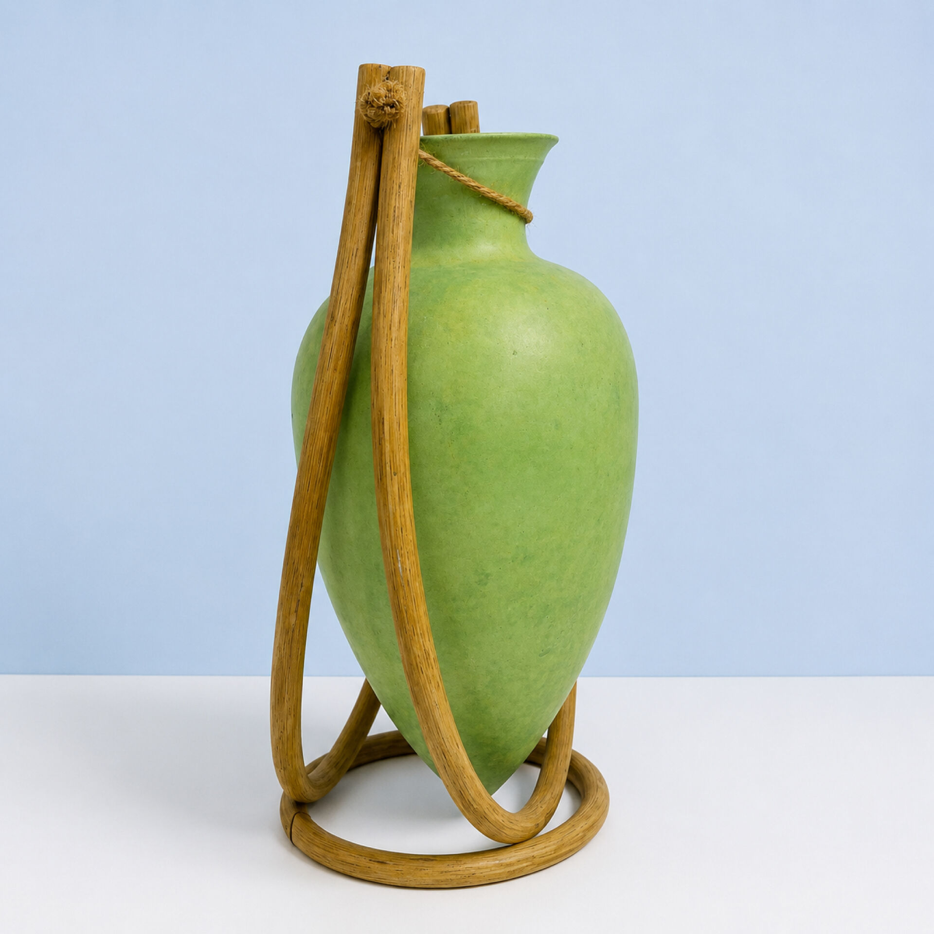 Rare glass paste amphora suspended in a wicker frame.