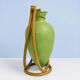 Rare glass paste amphora suspended in a wicker frame.