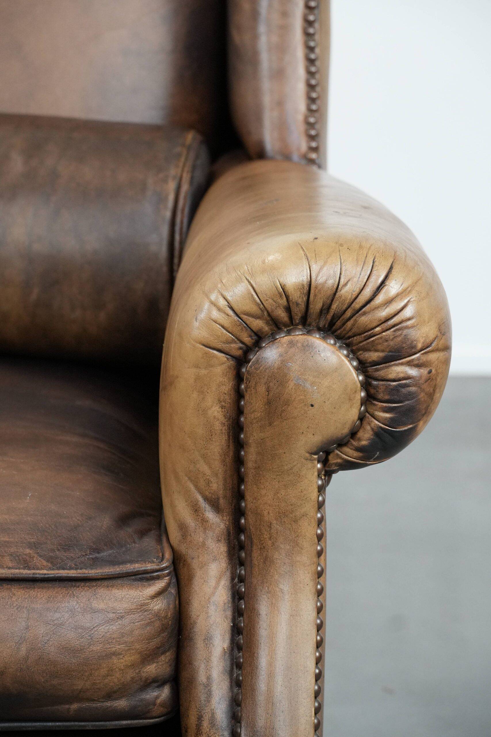 Luxury and large cowhide leather wingback chair in English style