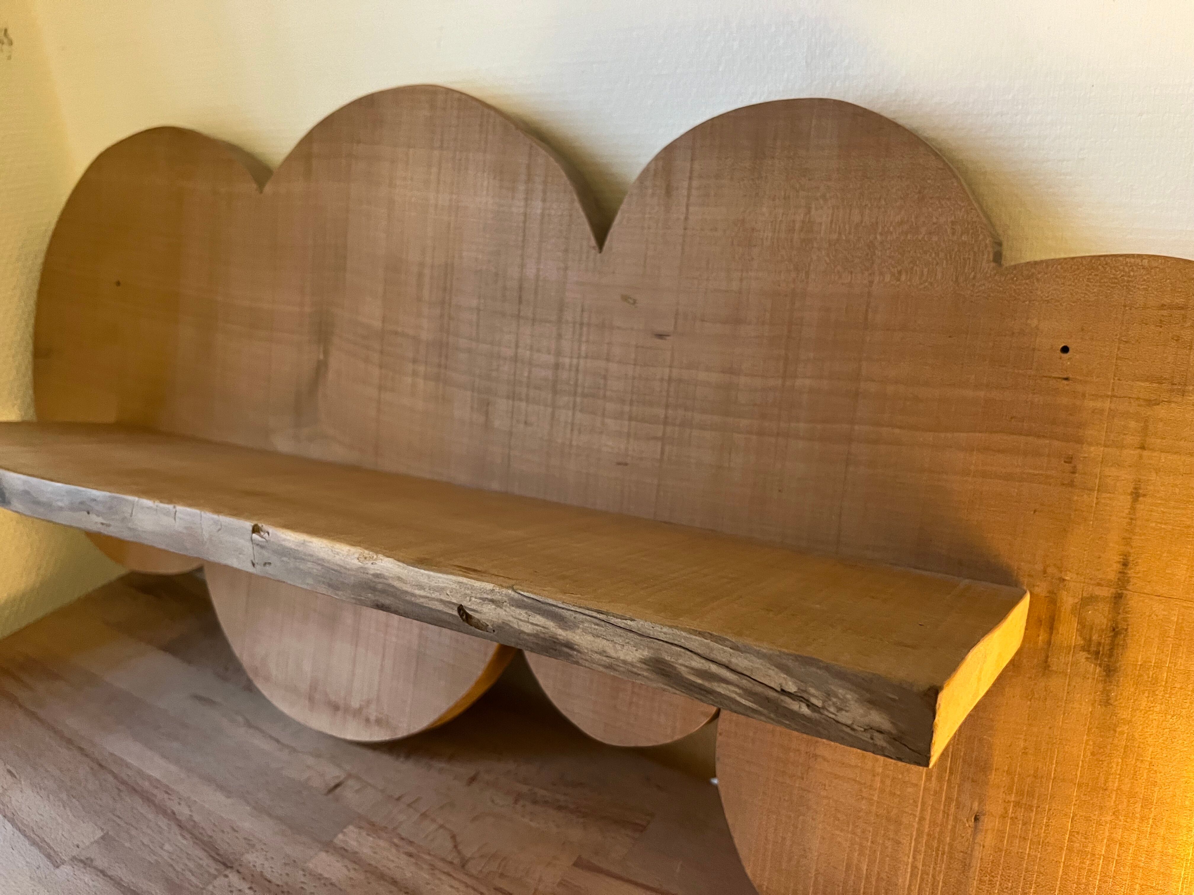 Cloud-shaped shelf made of solid wood