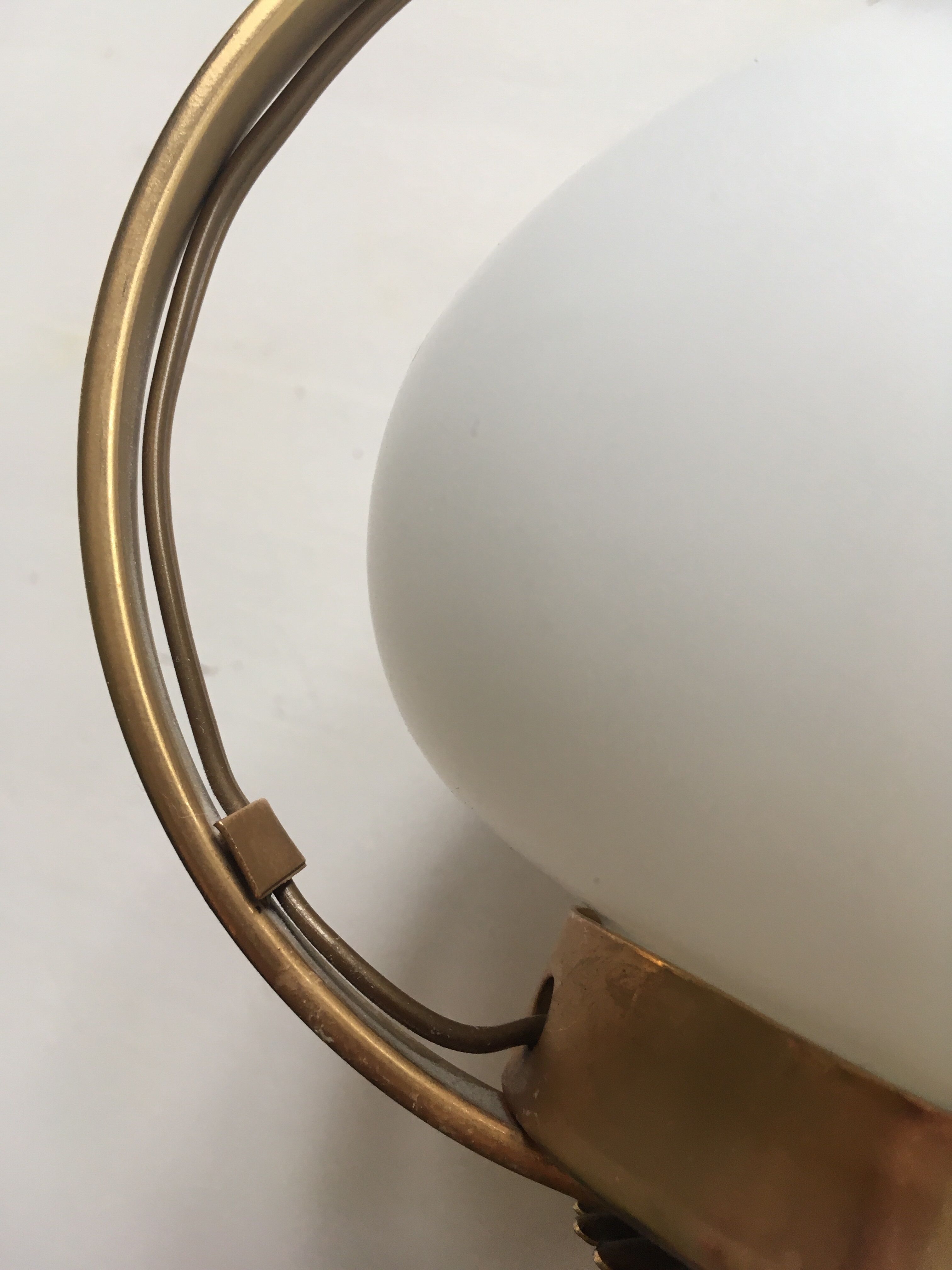 Pair of white tulip and brass pendant lamps