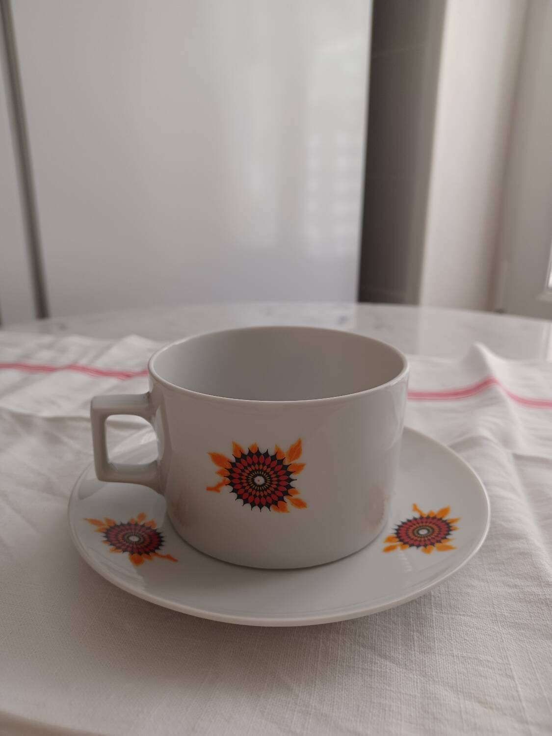 Vintage orange patterned cup and saucer