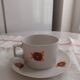 Vintage orange patterned cup and saucer